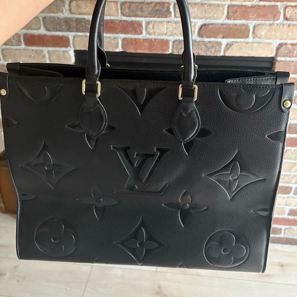Black Leather Tote with Embossed Monogram and Structured Design